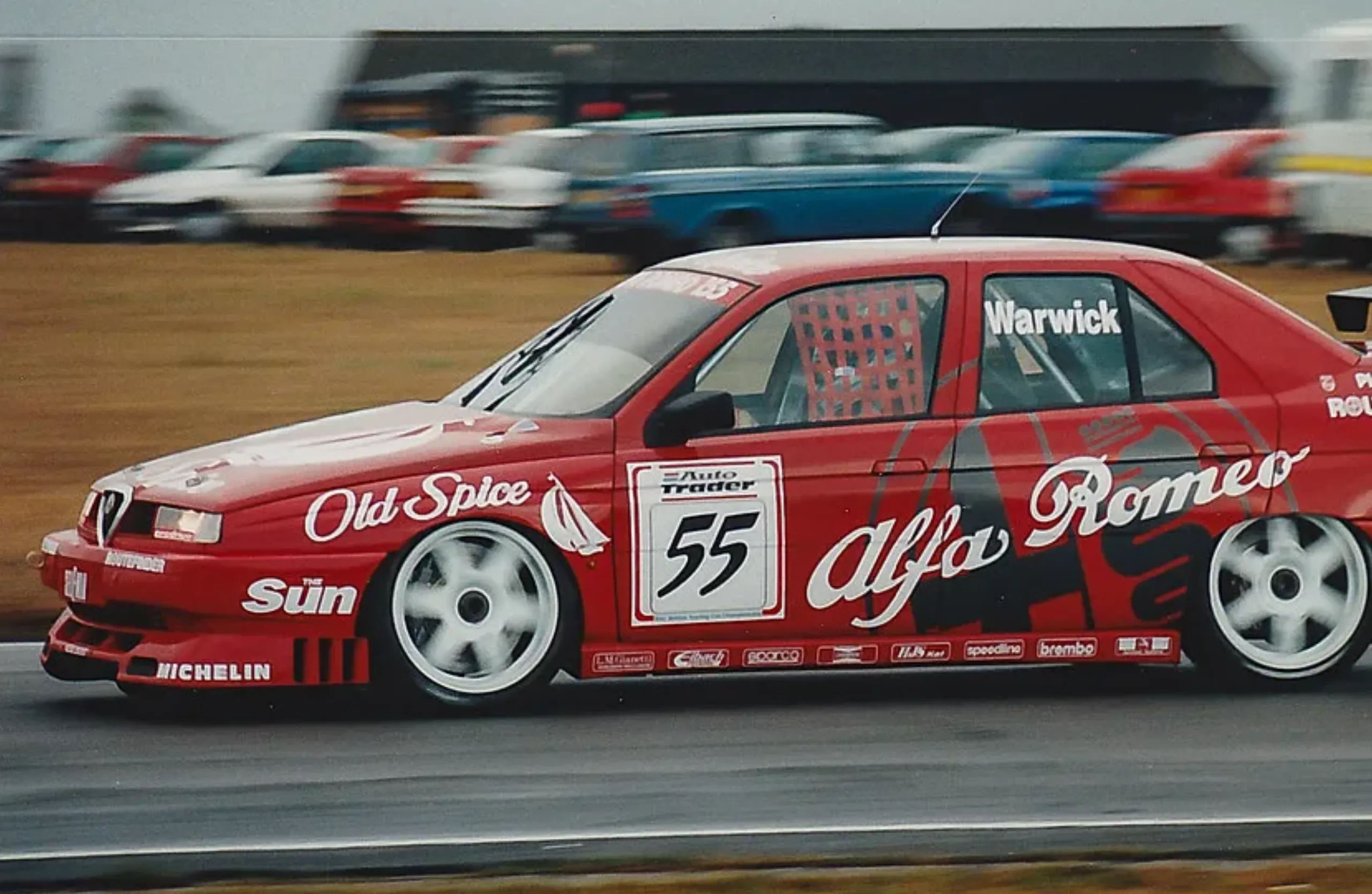 Derek Warwick&rsquo;s red Alfa Romeo 155 in the British Touring Car Championship, with Old Spice and Auto Trader sponsorship